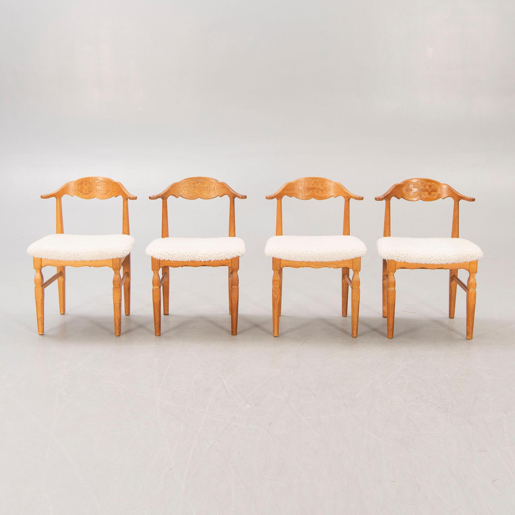 A set of 14 Henning Kjaerulf 1950s oak chairs.