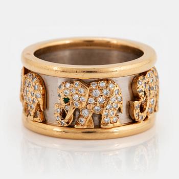 908. A Cartier "Elephant" ring in 18K gold and white gold set with round brilliant-cut diamonds and emeralds.