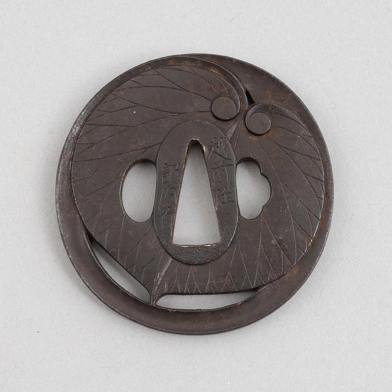 Tsuba, Japan, signed Echizen Ju Kinai, mid-1600s.
