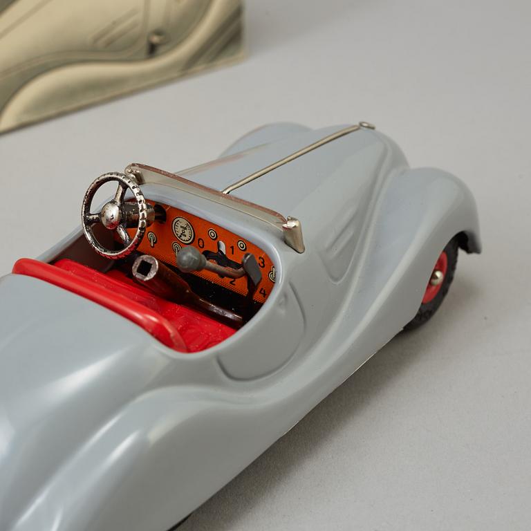 Two Schuco toy cars, Germany, mid 20th Century.