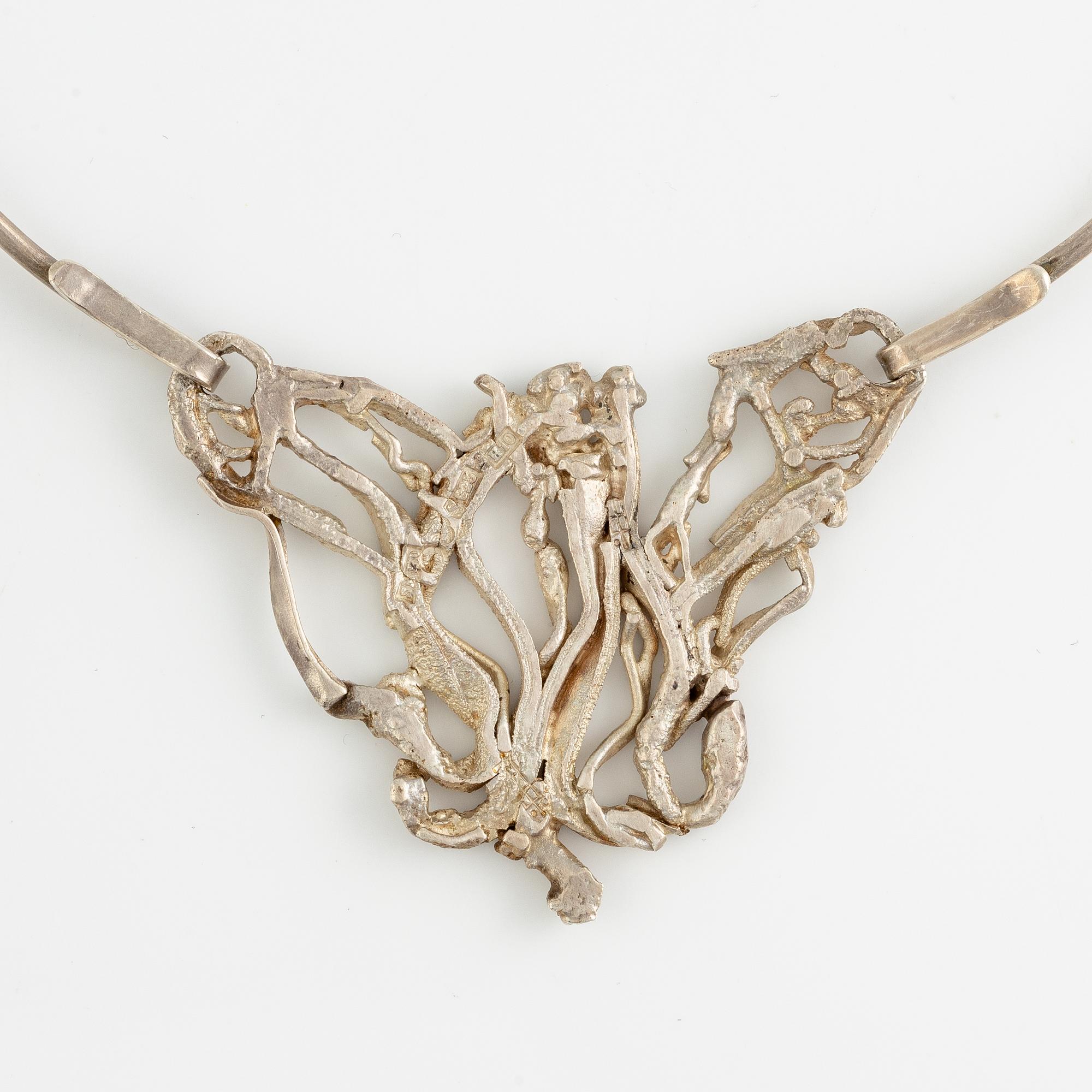 Lars Arby, three neck rings with pendants, silver, Gothenburg including 1977, 1978, and 1982.