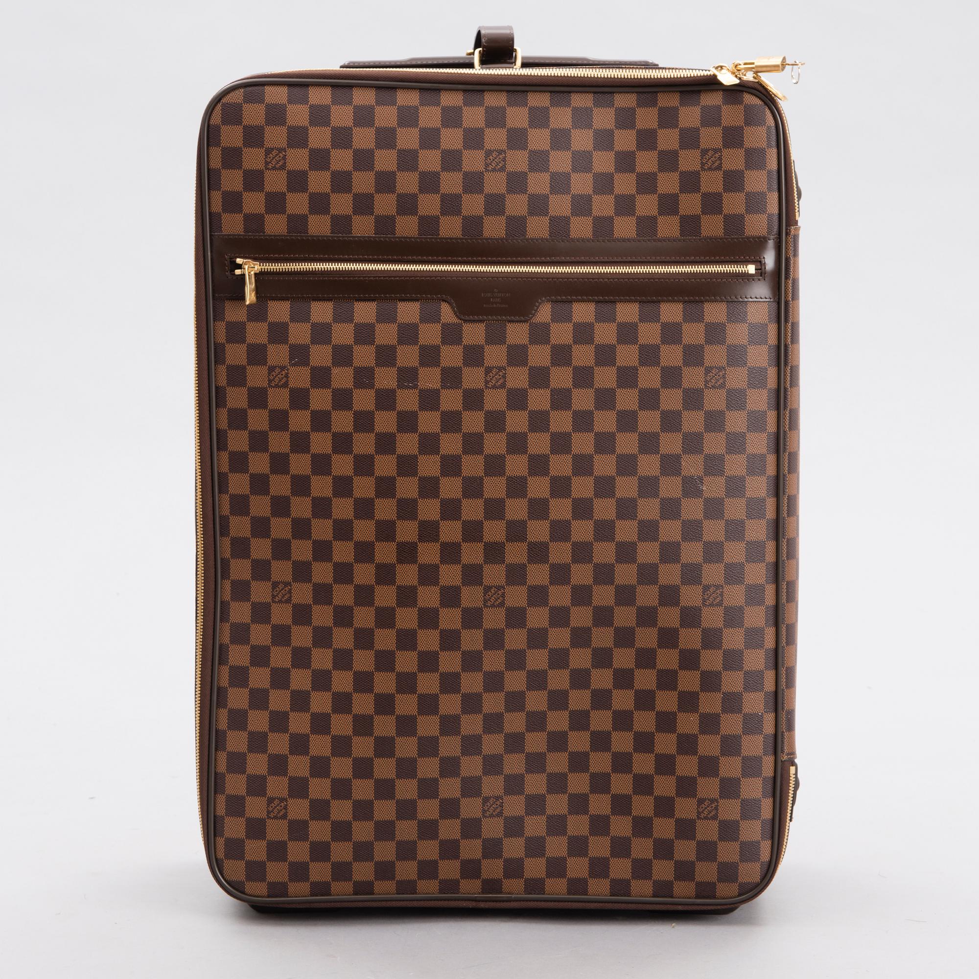 LOUIS VUITTON Damier Ebene Brown Pégase Suitcase with protective cover.