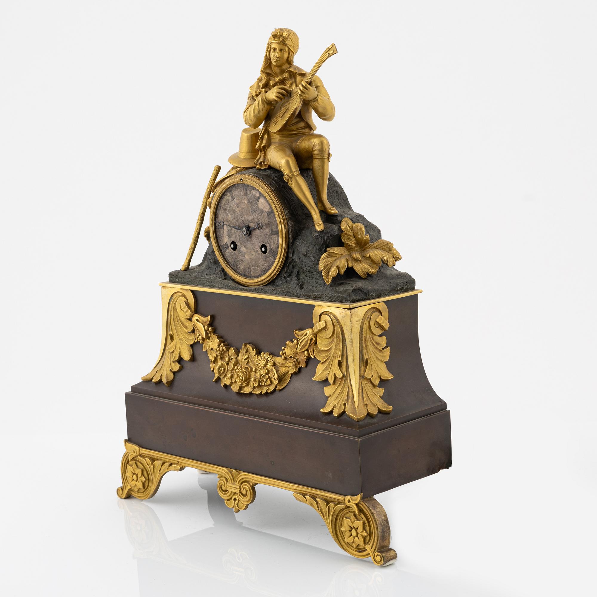 An ormolu and patinated bronze mantel clock, mid 19th Century.