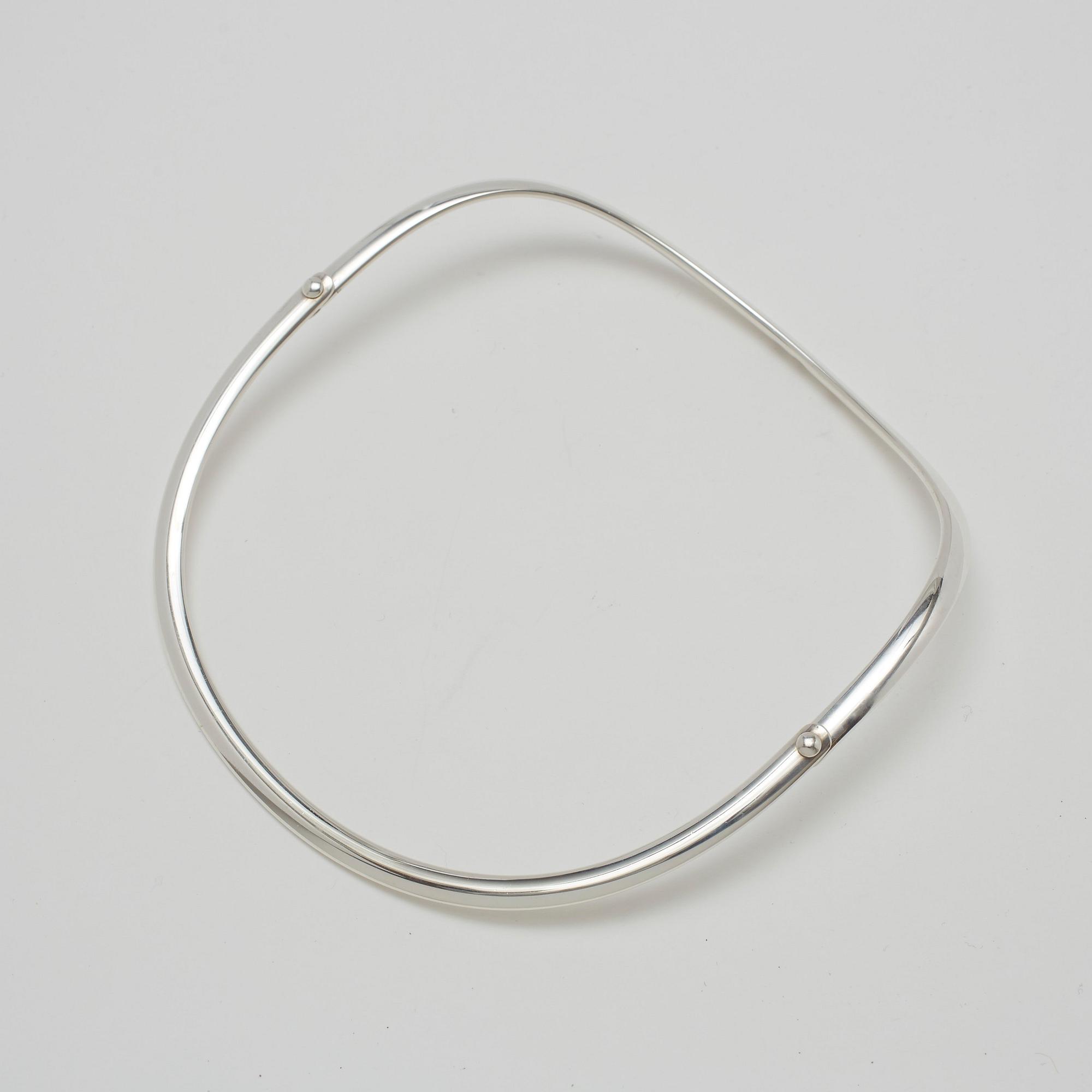 Vivianna Torun Bülow-Hübe, a sterling set of a necklace, a bangle and a ring, by Georg Jensen, Copenhagen.