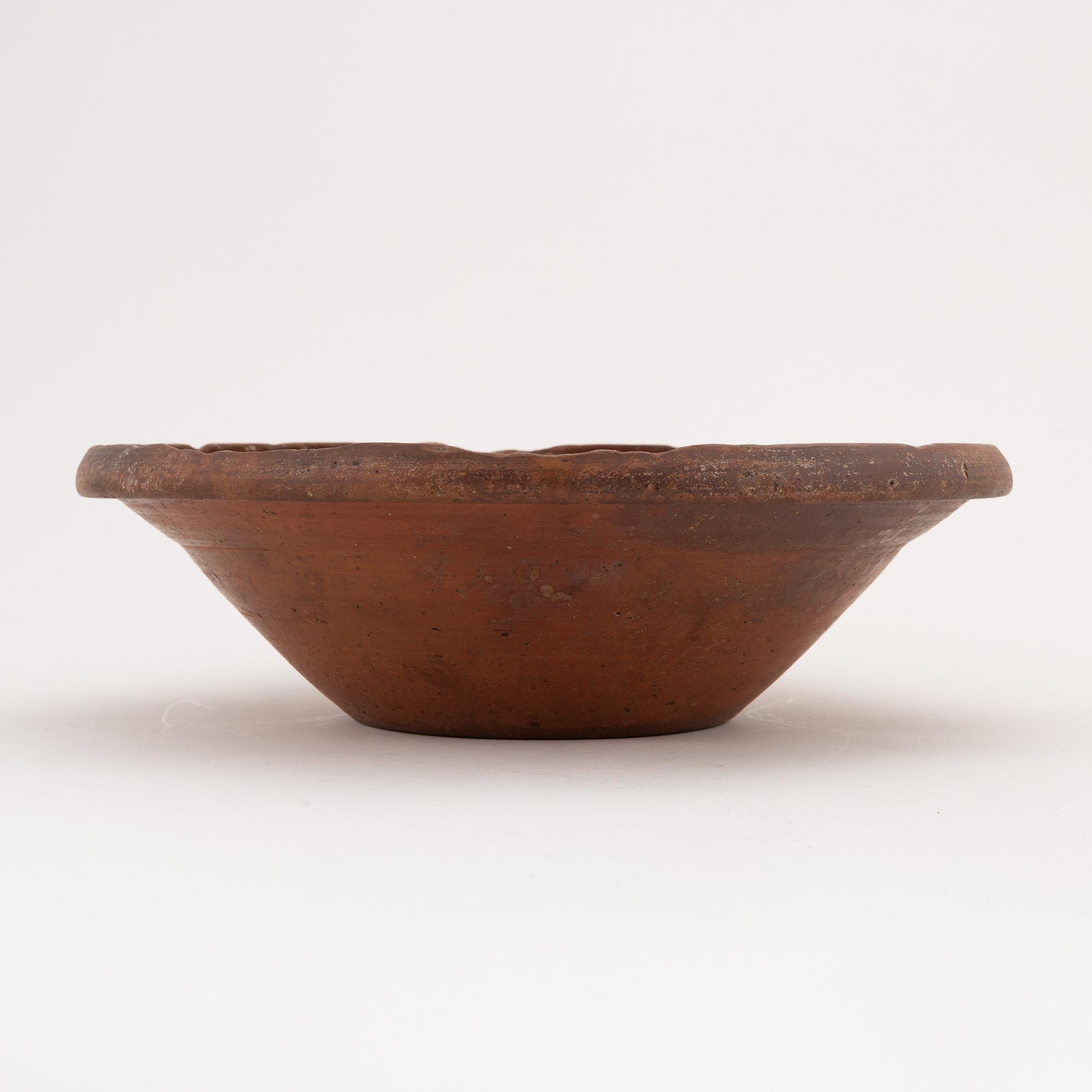 Two clay Swedish folk art dishes, 19th Century.