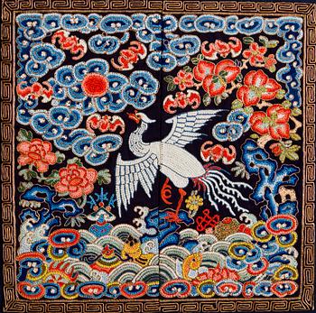 An embroidered civil official's rank badge with a silver pheasant, Qing dynasty, Tongzhi period (1862-1874).