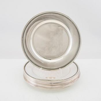 A set of 12 silver plates mark of GAB Stockholm 1963, total weight 6000 grams.