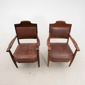 A pair of early 1900s armchairs.