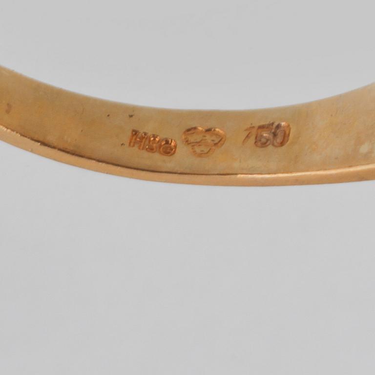RING, 18K guld och vitguld med 2 åttkantslipade diamanter, Kattfotstämplad. Vikt 1,8 gram.