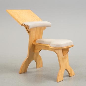 a "plugghästen" chair by Peter Lind.