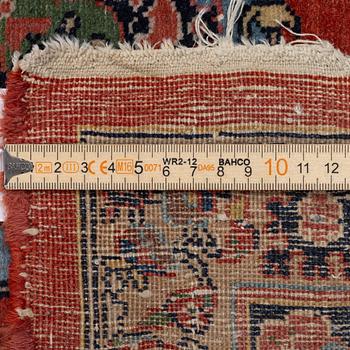 An oriental carpet, c. 370 x 275 cm.