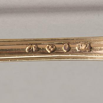 An early 19th century silver-gilt 24 piece table cutlery, mark of P Zethelius and G Folcker, Sthlm 1806 and 1826.