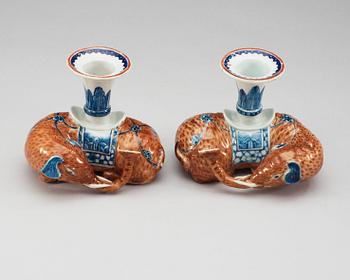 A pair of Export candle sticks in the shape of reclining elephants, Qing dynasty, Qianlong (1736-95).