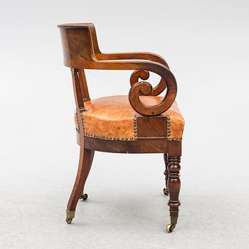An Empire armchair, 19th century.