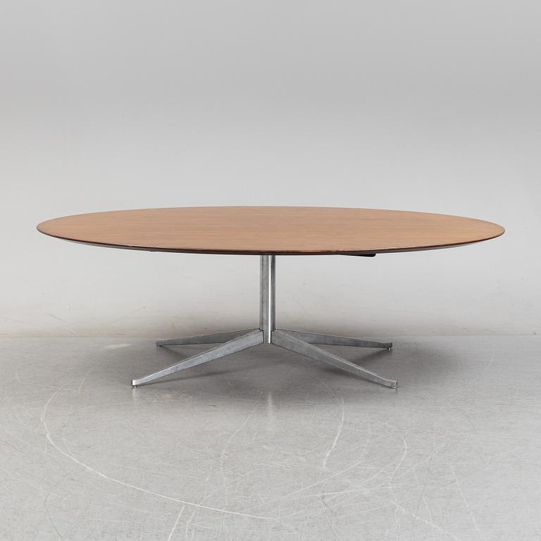 An 'Oval 96' table by Florence Knoll for Knoll International.