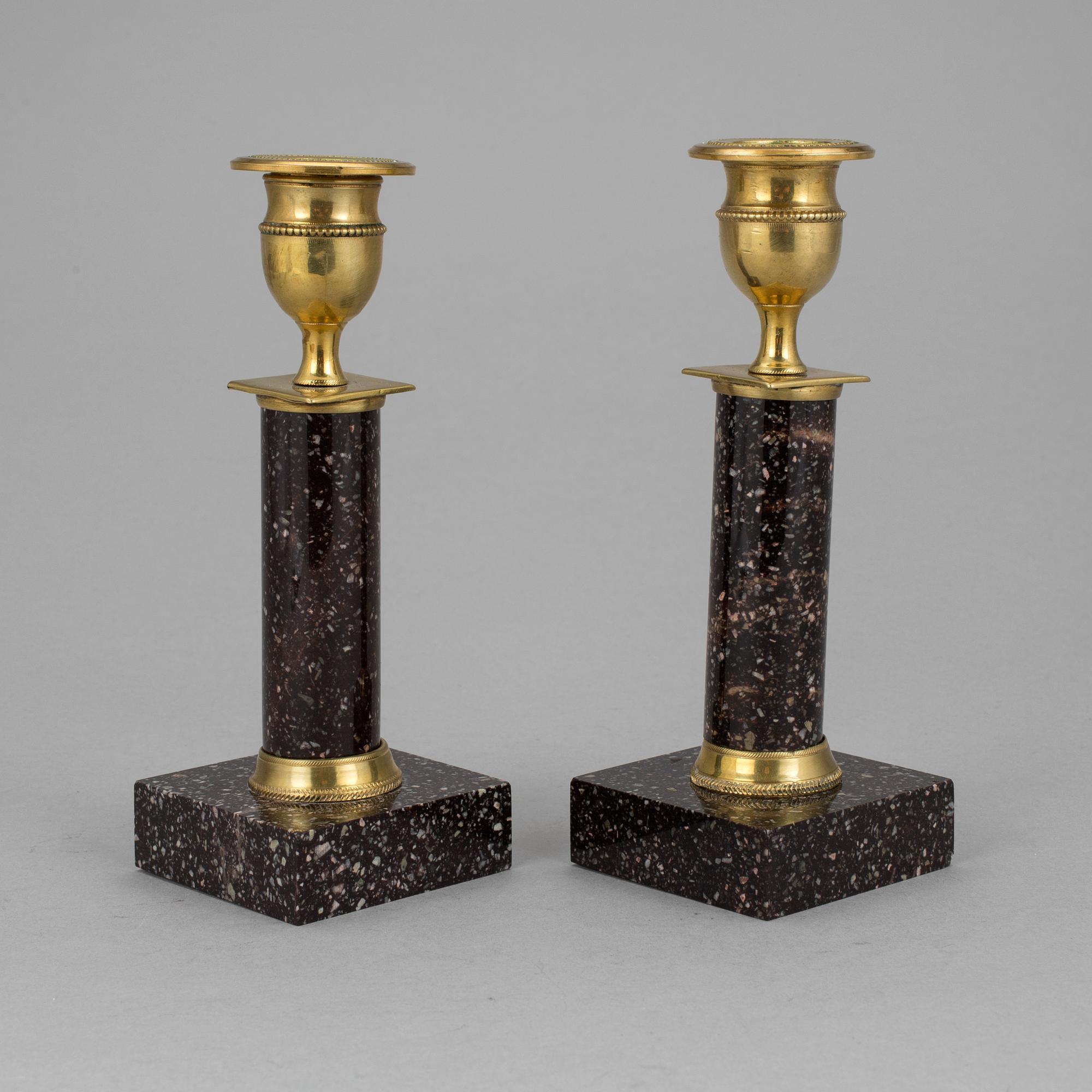 A pair of late gustavian porphyry candle sticks early 19th century.