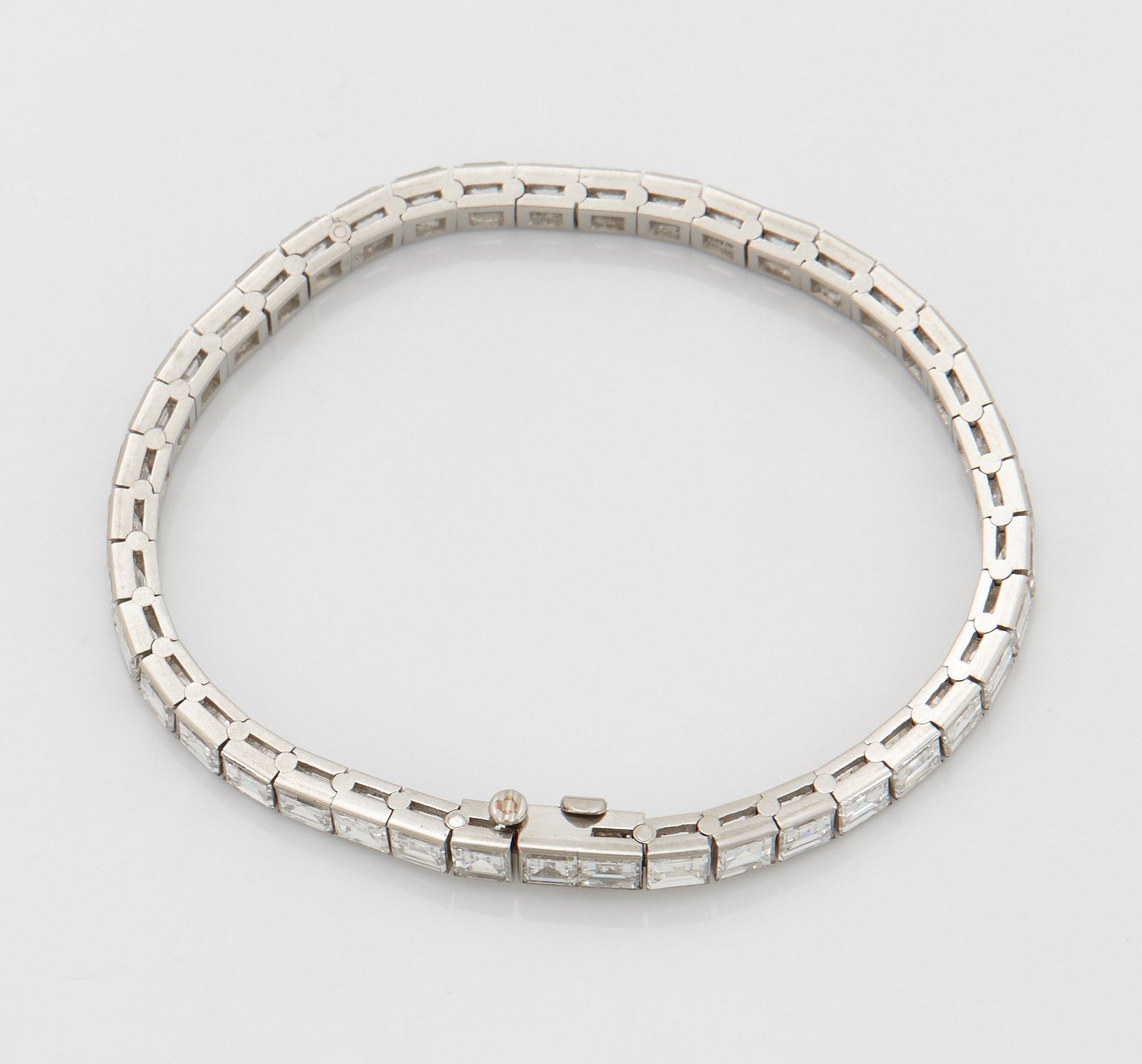 A platinum bracelet set with carré cut diamonds.