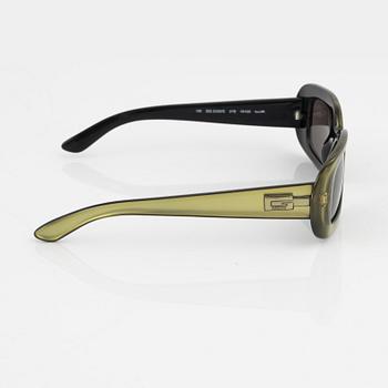 Gucci, a pair of green sunglasses.