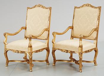 310. A pair of Régence-style circa 1900 armchairs.