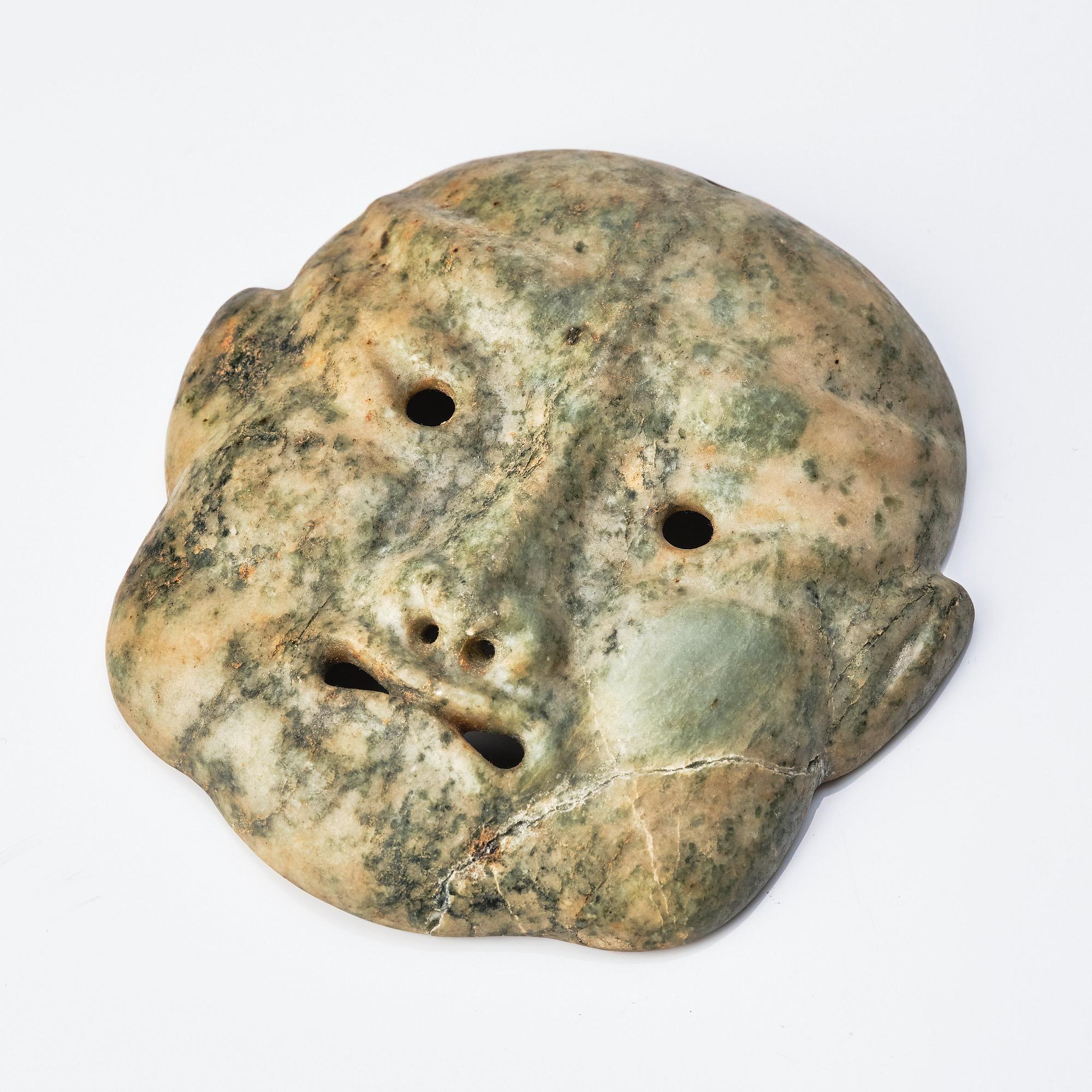 A Japanese sculptured face mask, Edo period (1603-1868).