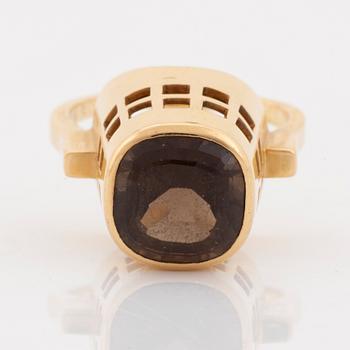 An 18K gold and smoke quartz Sigurd Persson ring.