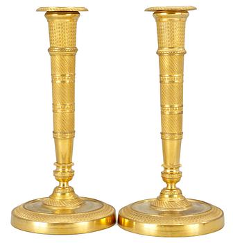 965. A pair of Empire candlesticks.