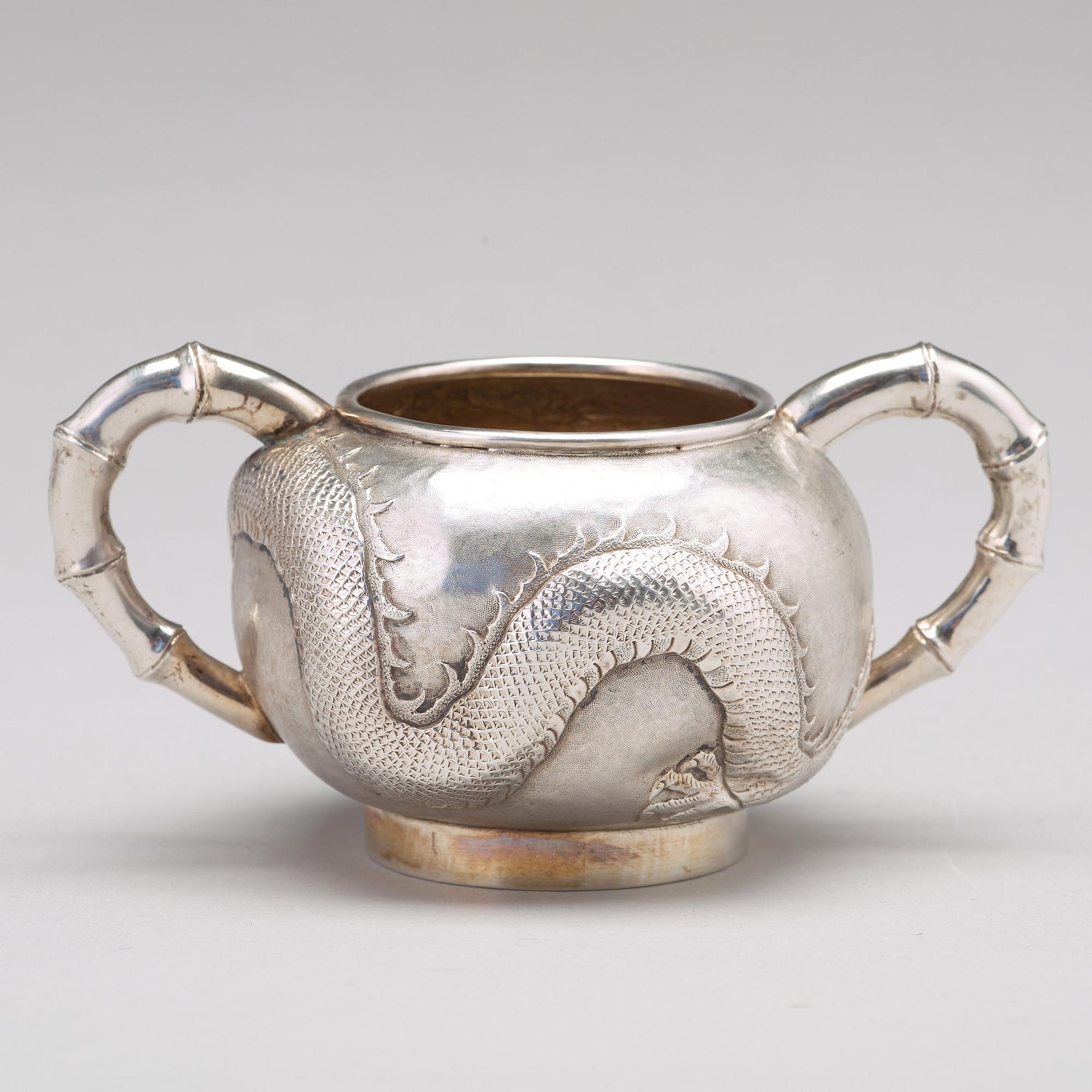 A Chinese four piece silver tea set, Luen Wo, Shanghai, 1875-1925.