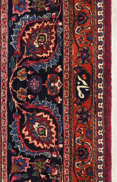 A semi-antique Meshad carpet, signed 'Saber', approx. 459 x 348 cm.