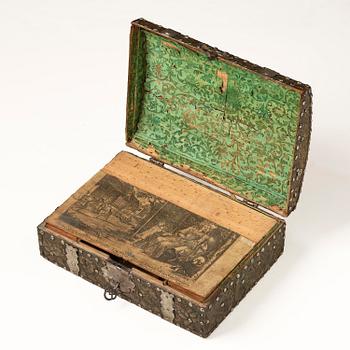 A presumably German baroque repoussé brass writing box, late 17th century.