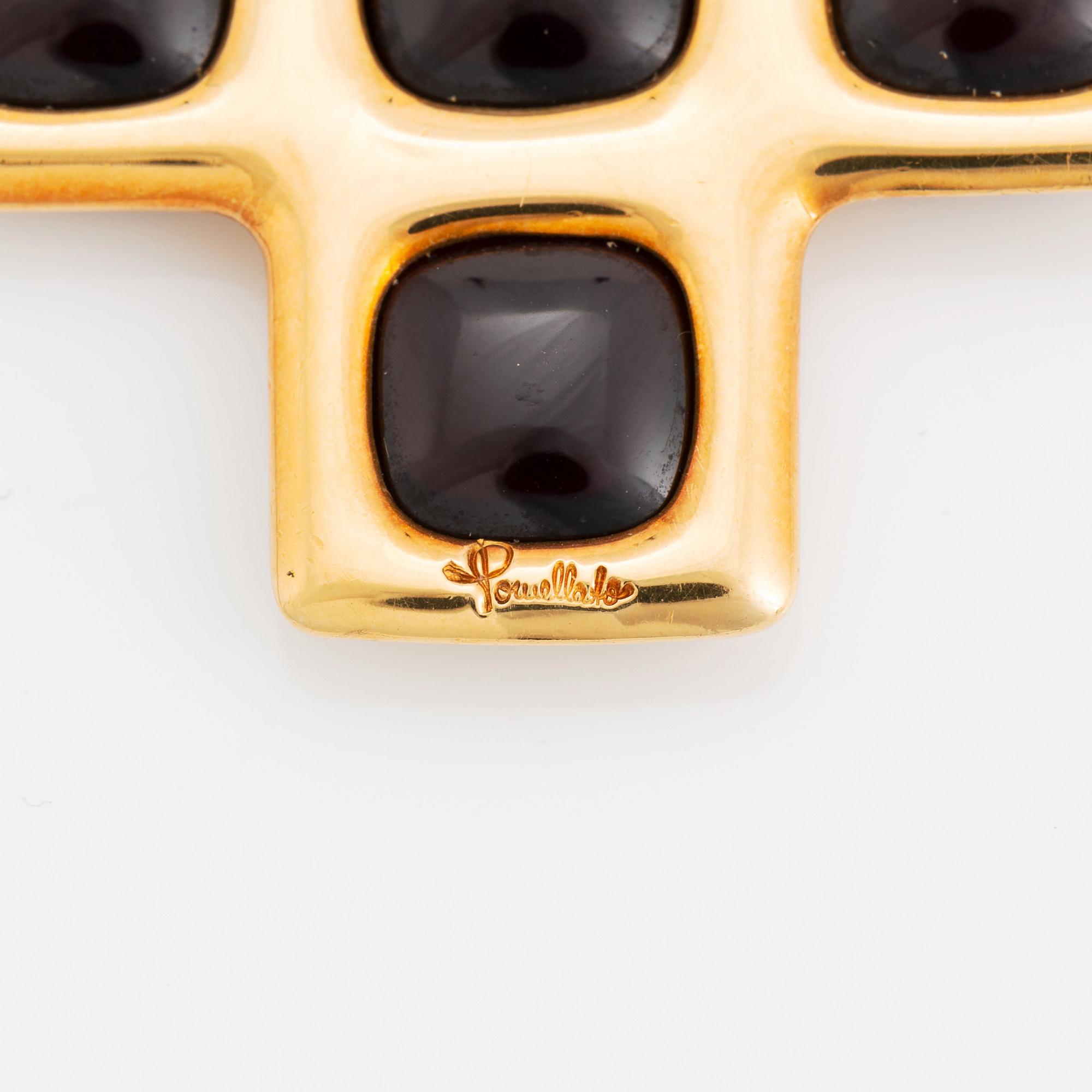 An 18K gold and garnet Pomellato cross.
