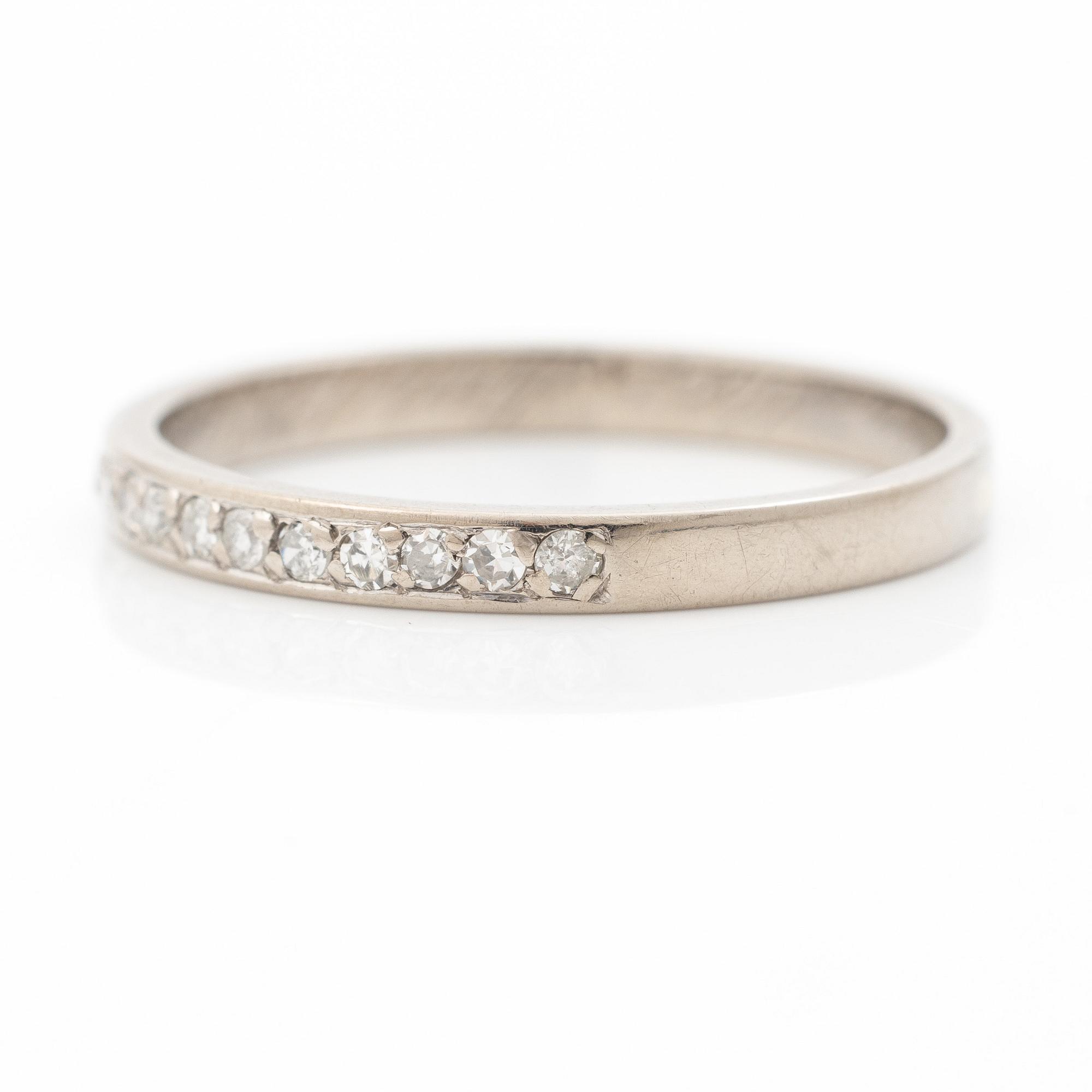 18K white gold half eternity ring with octagonal-cut diamonds.