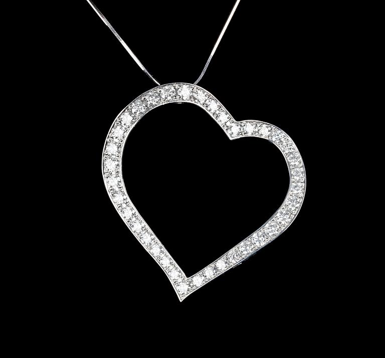 A brilliant cut diamond heart pendant, tot. 8.10 cts.