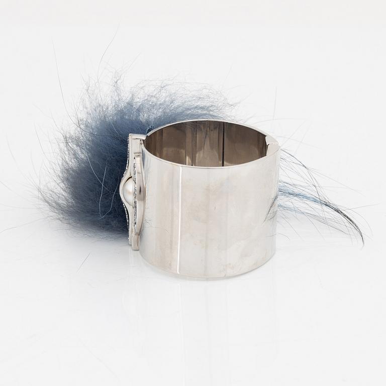 Fendi, a silvertone metal, rhinestone and fur bracelet.