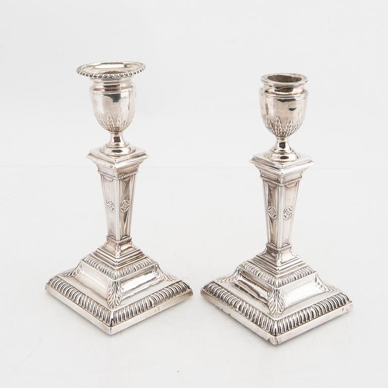 An English 20th century pair of silver candle sticks mark of Mappin & Webb London around 1900.