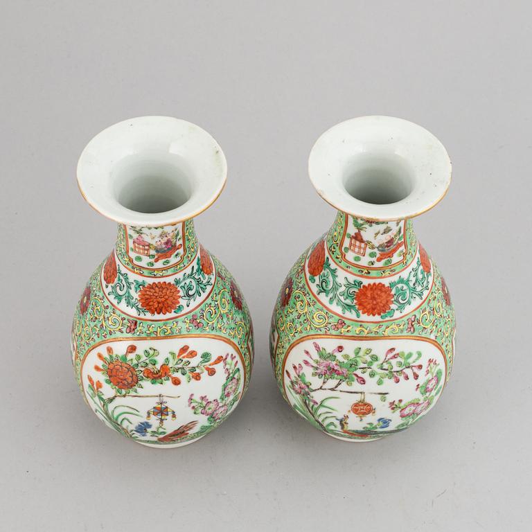 A pair of famille rose canton vases, early 20th century.