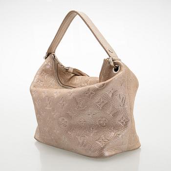 Louis Vuitton, a shimmer 'Halo' bag.