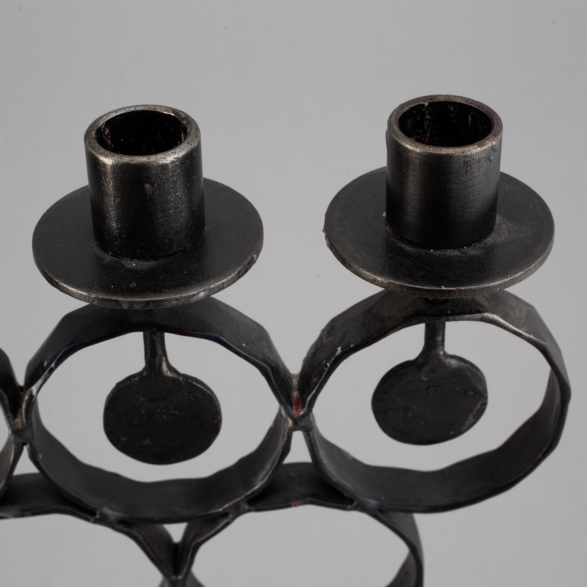 A cast iron candelabra by Bertil Vallien for Kosta Smide, Sweden.