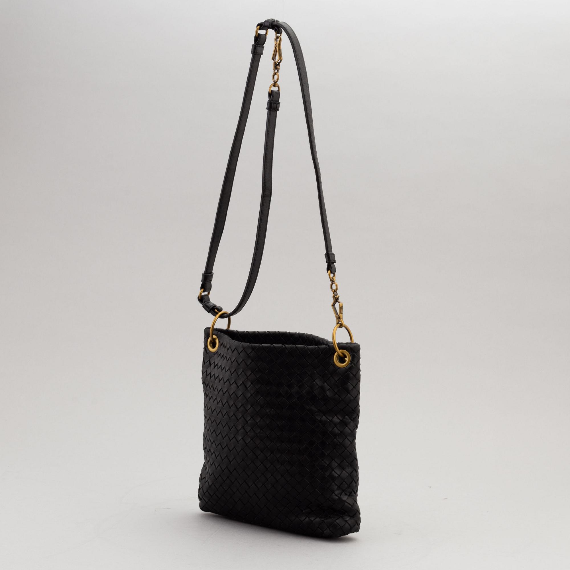 Bottega Veneta, a black intrecciato handbag.