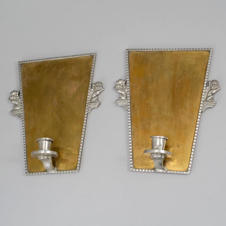 A pair of wall sconces by CG Hallebrg dated 1929.