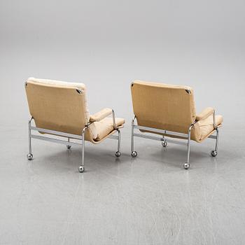 Bruno Mathsson, a pair of easy chairs and a coffee table, 'Karin', Dux, second half of the 20th Century.
