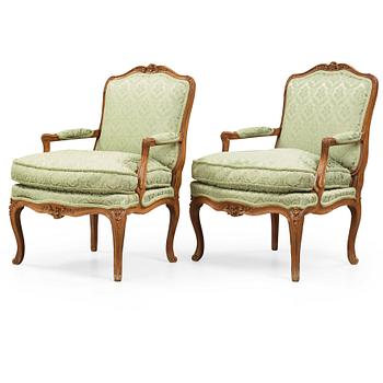 30. A pair of Louis XV 18th century armchairs.