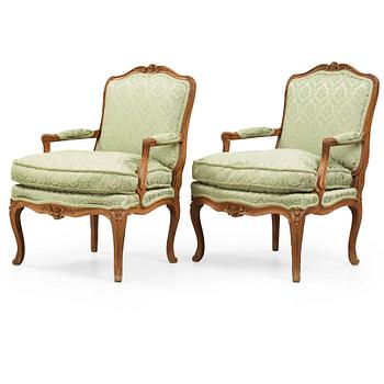 30. A pair of Louis XV 18th century armchairs.