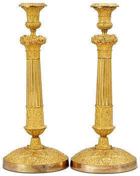 1047. A pair of Empire candlesticks.