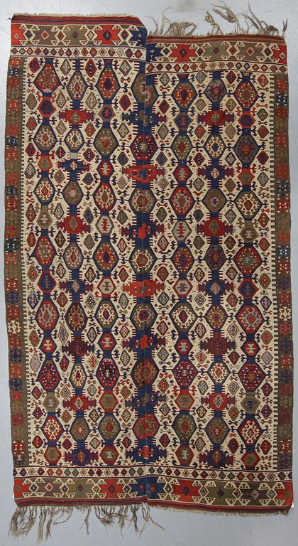 A carpet, a kilim, an antique Anatolian, ca 310-326 x 183,5-192 cm.