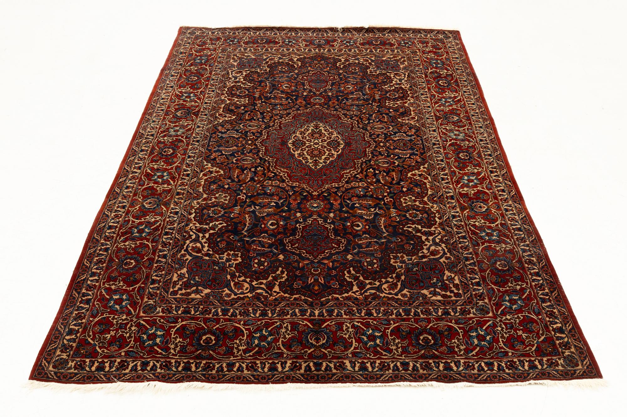 A semi-antique Isfahan rug, central Persia, c. 305 x 205 cm.