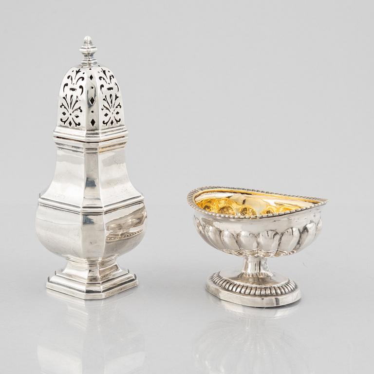 A silver sugar caster from E. S. Barnsley & Co, Birmingham,  1914, and a silver salt cellar with indistinct marks.