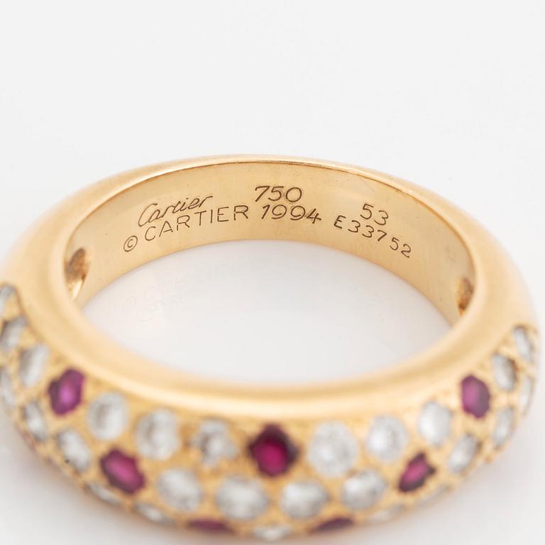 An 18K gold Cartier ring set with round brilliant-cut diamonds and rubies.