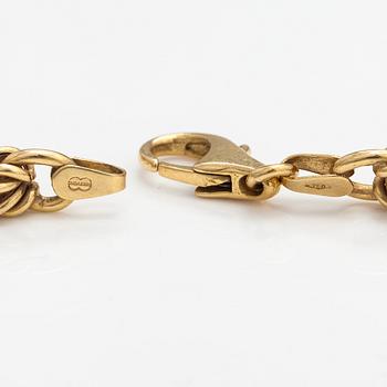 An 18K gold necklace. Unoaerre, Italy.