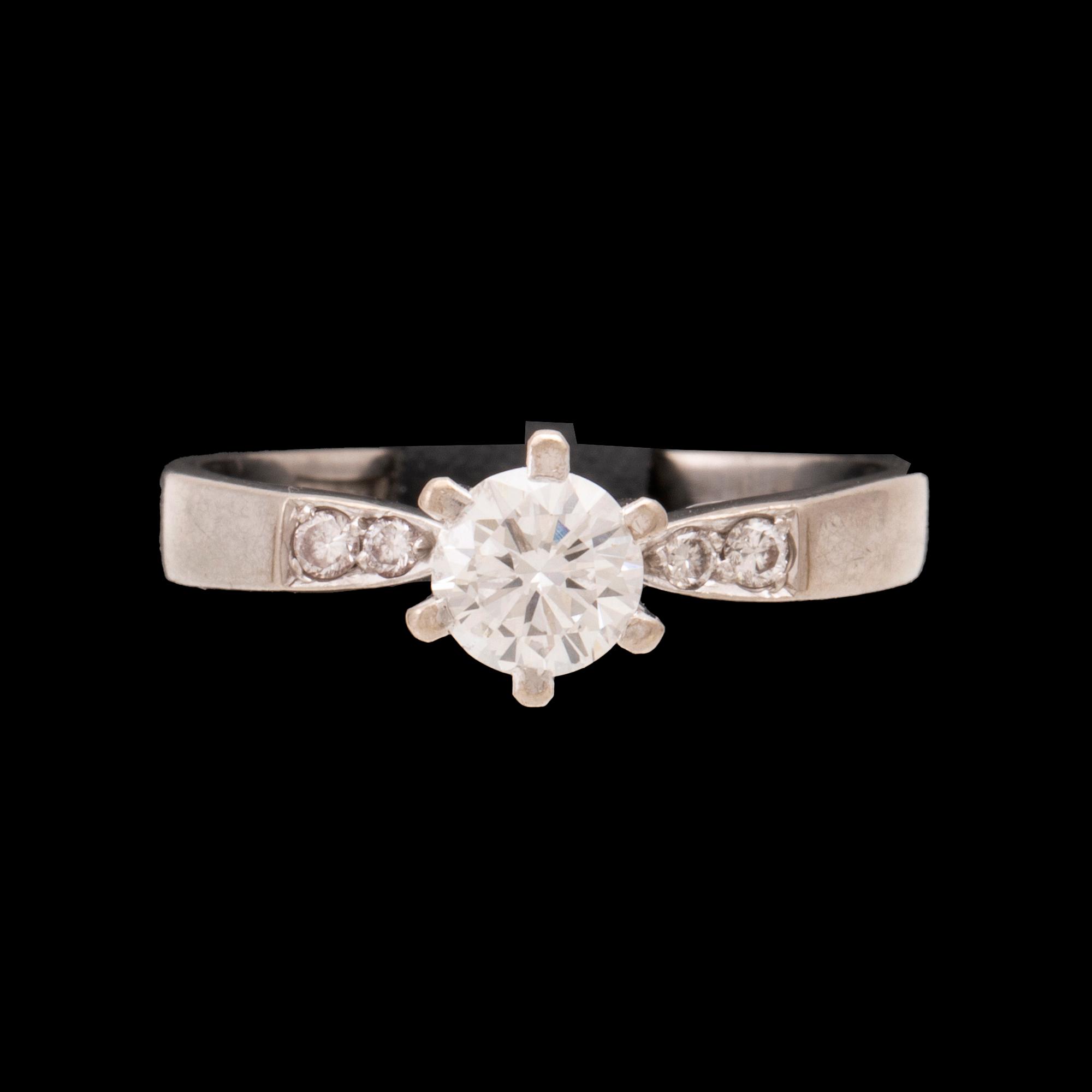 An 18K white gold ring set with round brilliant cut diamonds by Lundberg Guldatelje Amie Stockholm 1977.