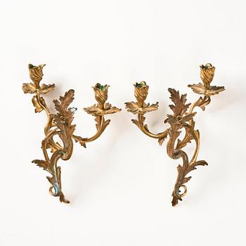 A pair of Swedish rococo ormolu two-branch wall-lights, later part of the 18th century.